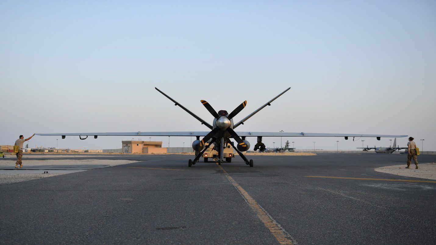 Figure 1: USAF technicians prepare an MQ-9 Reaper drone from the United States Central Command area of operations. Notice the fuel tanks attached to the drone to significantly increase its operational radius.